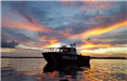 Marine Patrol Boat During a Sunset