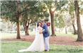 Bride and Groom Embrace in Spanish Moss-Covered Trees