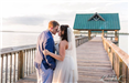 Bride and Groom Embrace on Dock