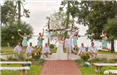 Bride, Groom, and Wedding Party at Outdoor Altar