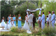 Bride, Groom, and Wedding Party During Wedding Ceremony