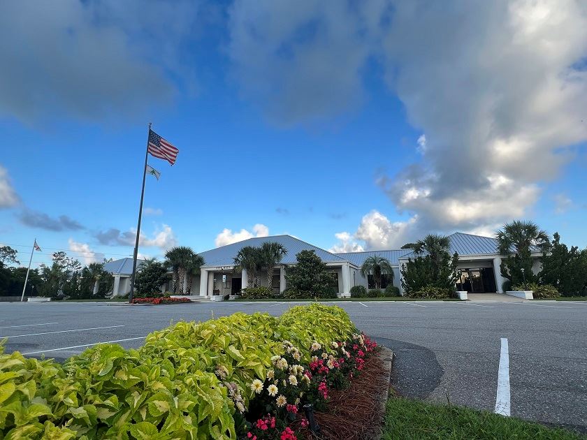 Parking lot in front of Orange Beach City Hall with flowers