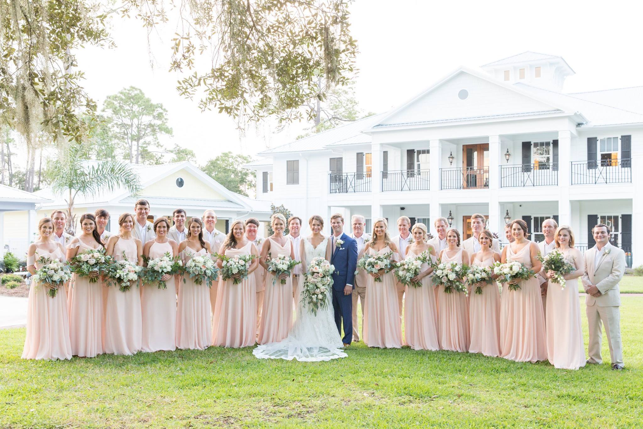 Large wedding party; pink dresses