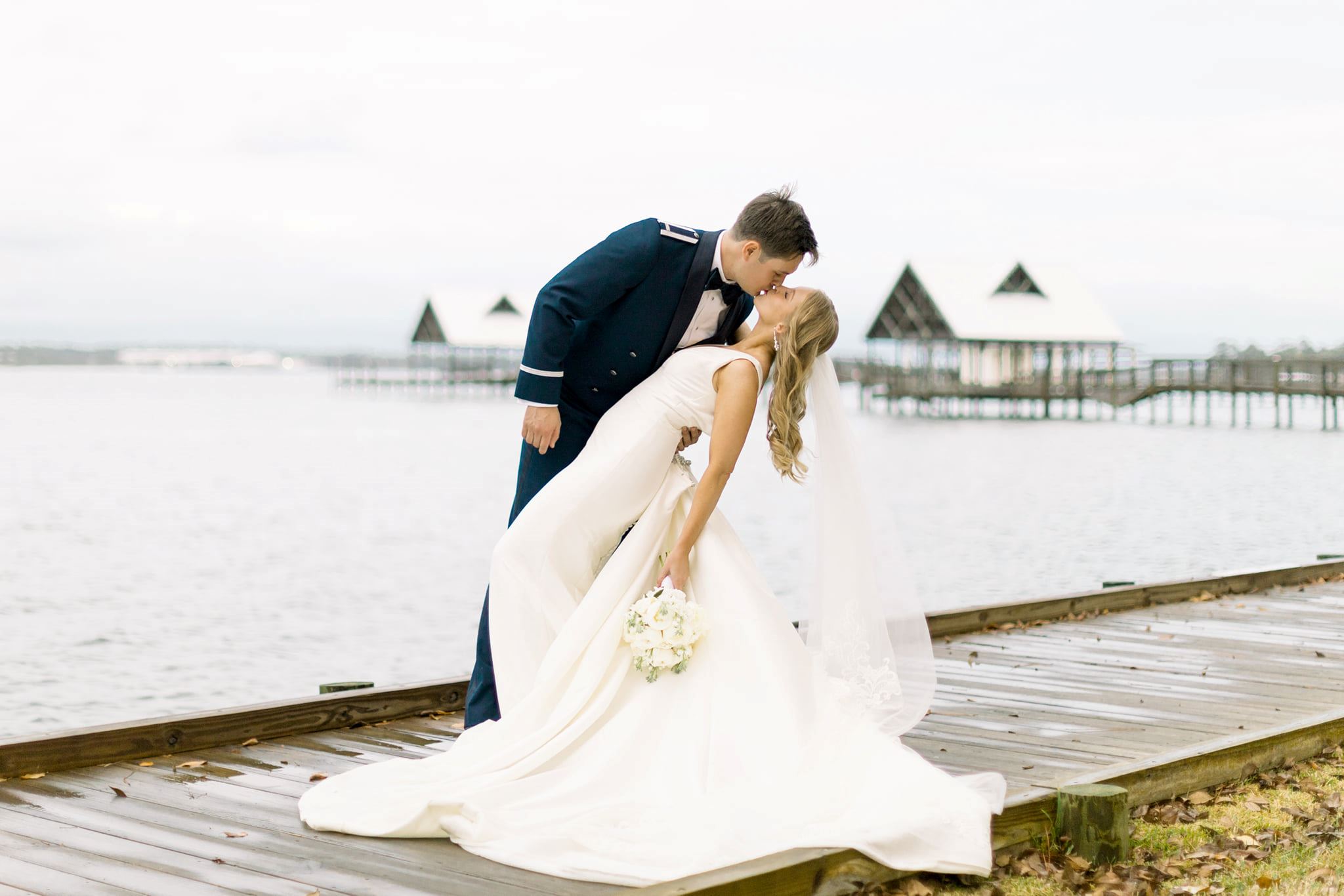 Couple kissing on boardwalk