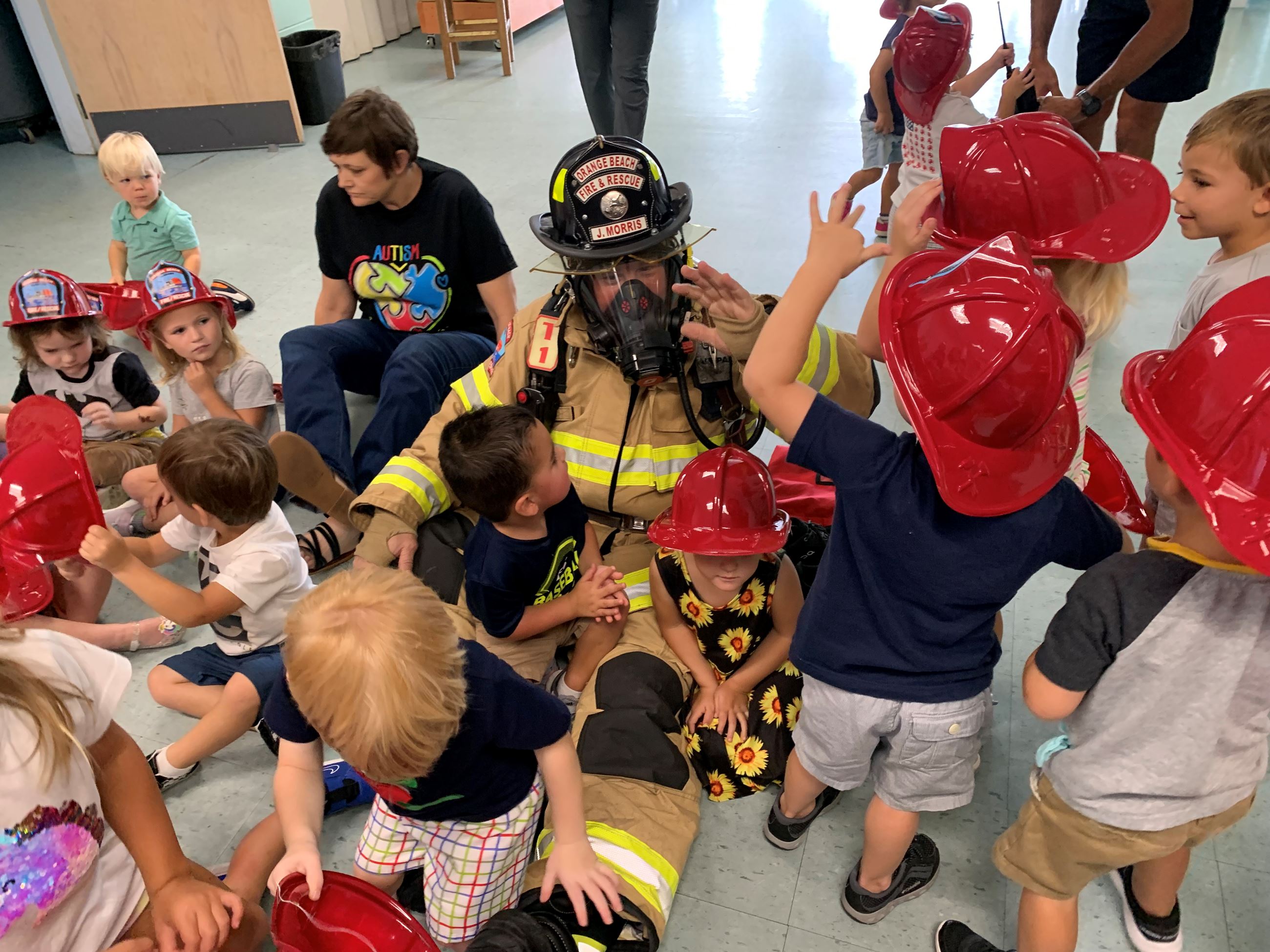 Friendly Firefighter with prek children