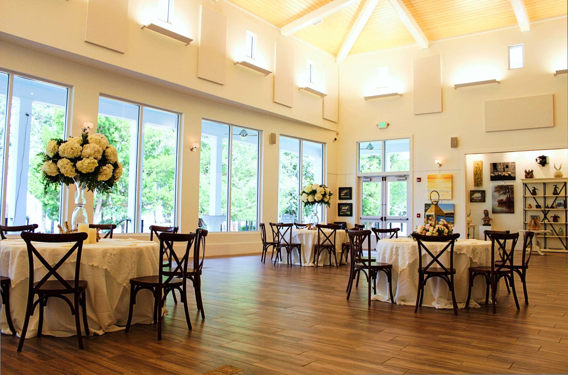 Wedding reception setup in art gallery.