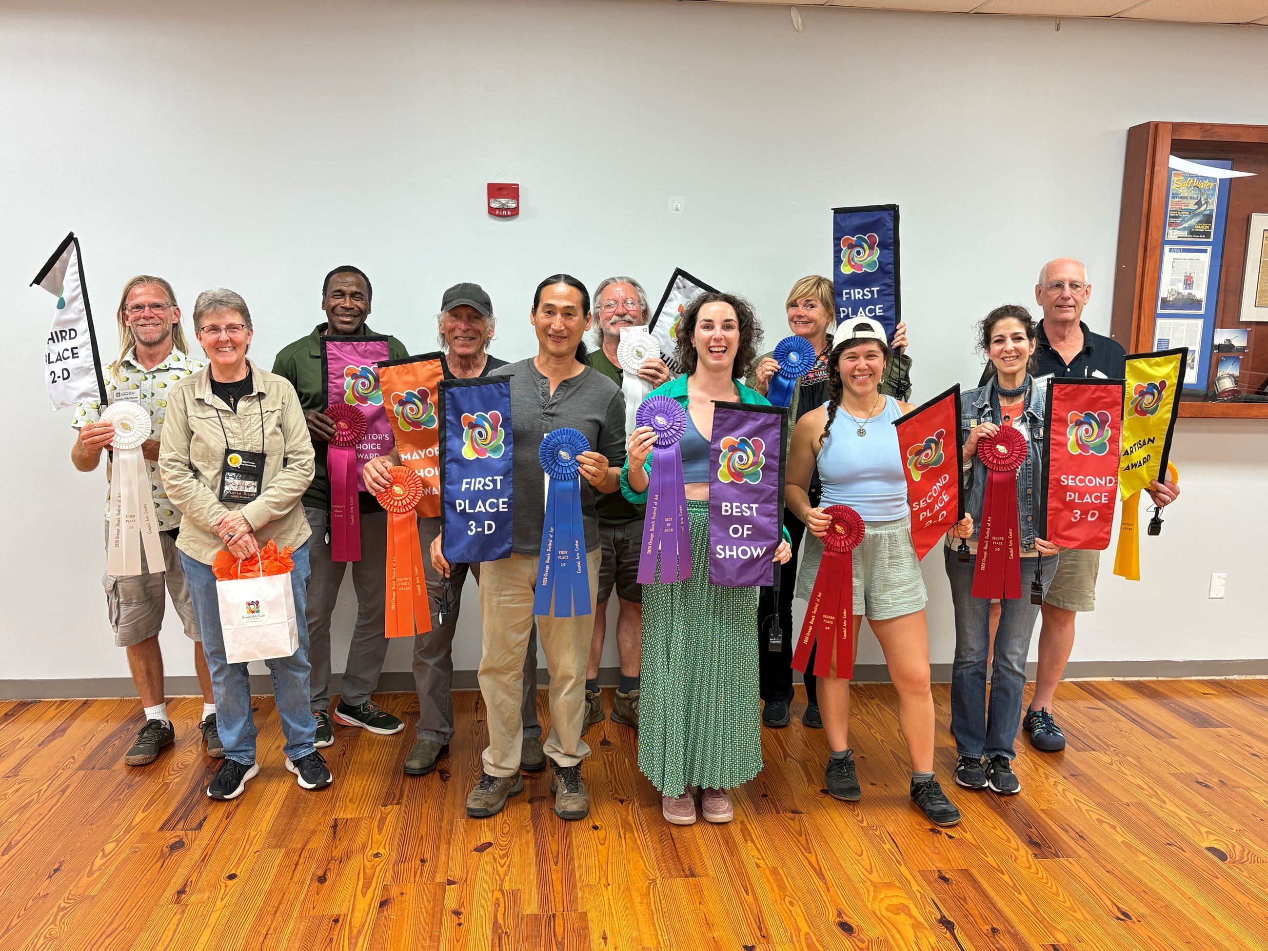 Group of winners with their award ribbons