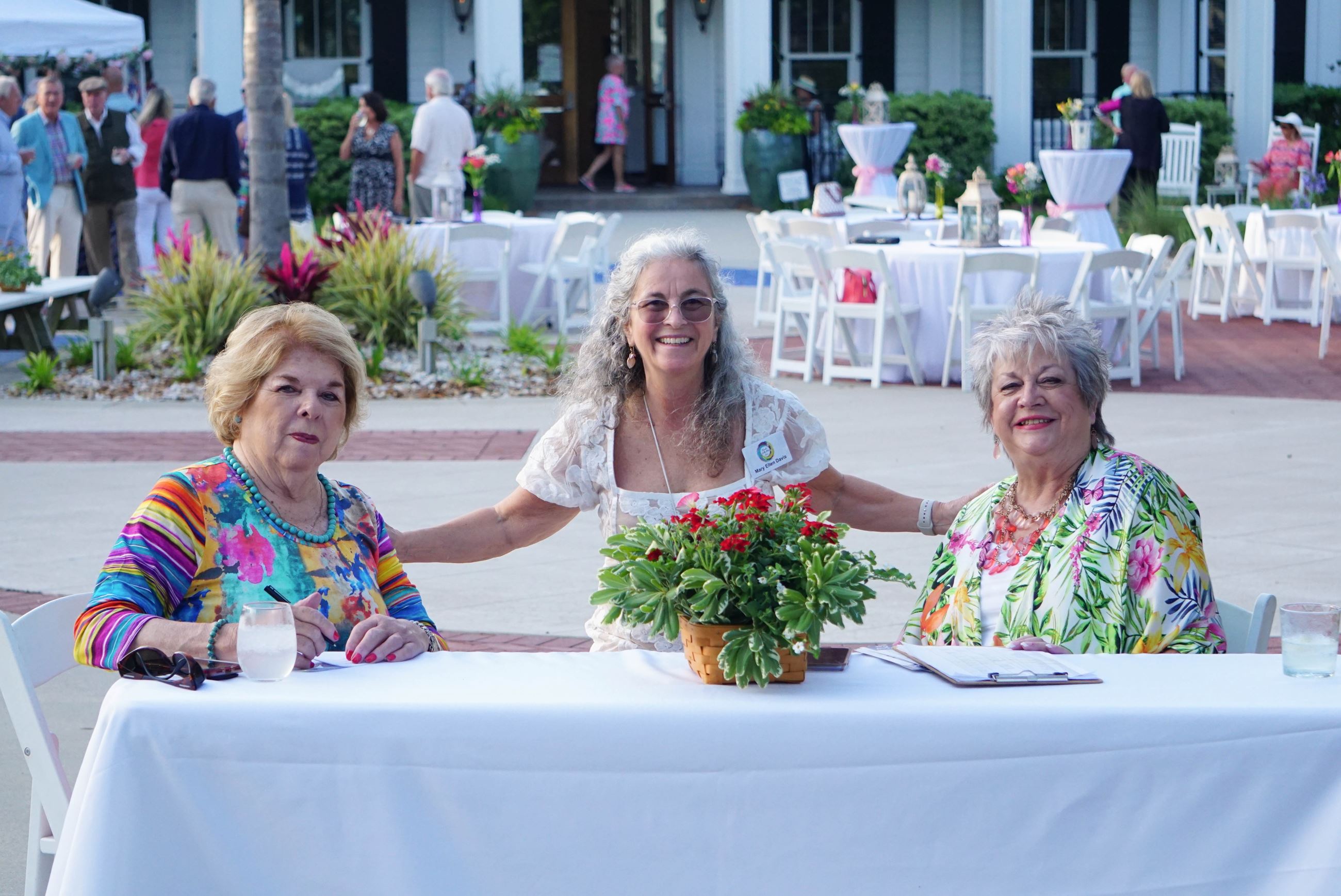 Three ladies at welcome table
