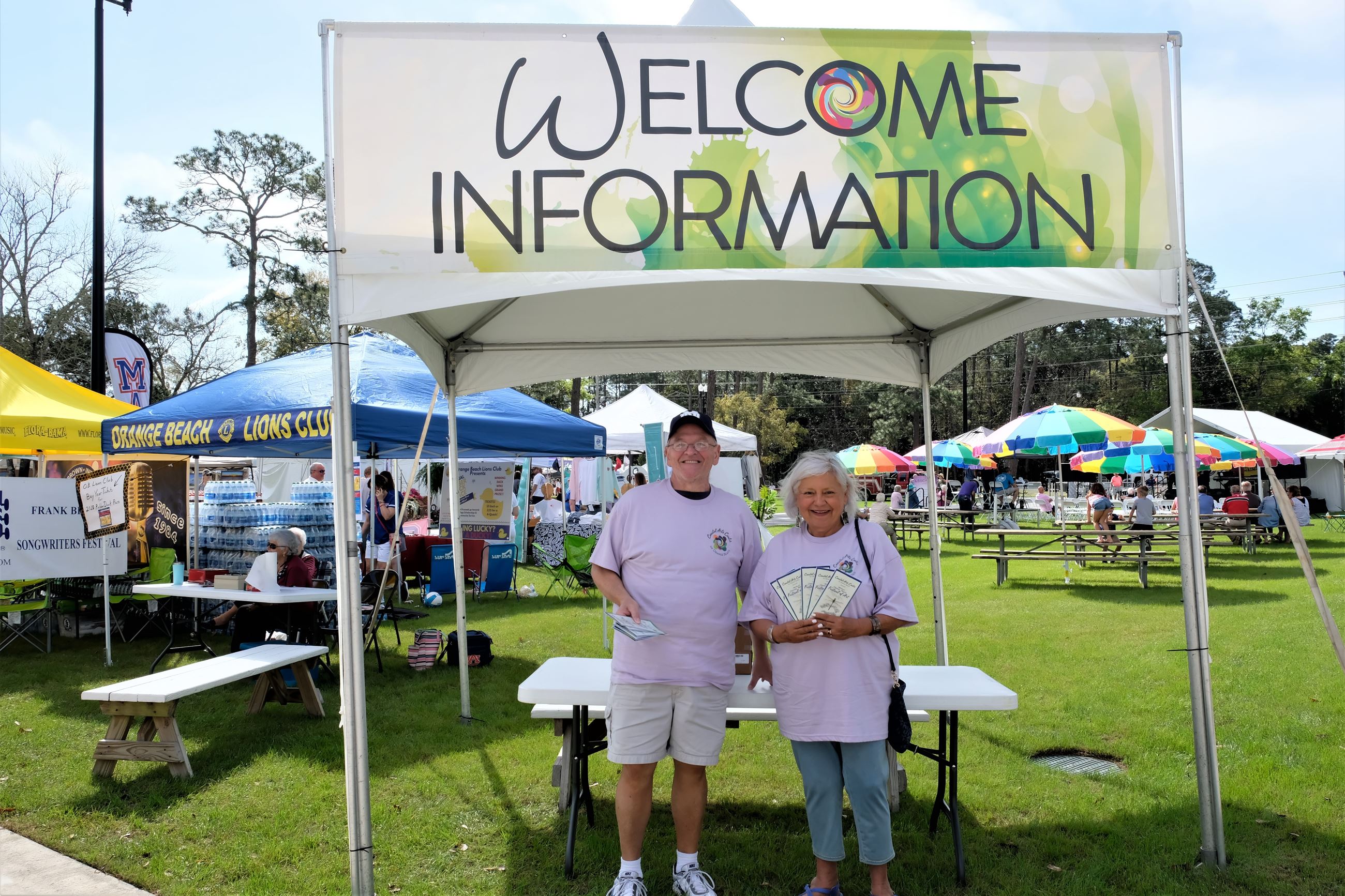 Two greeters at Welcome Tent