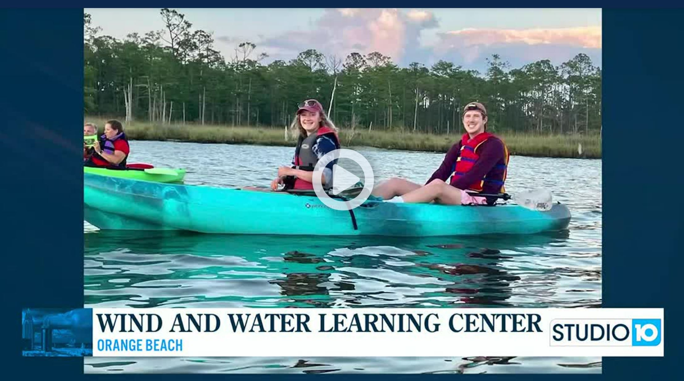 Screenshot of opening clip of news coverage of Wind and Water Learning Center - people on kayaks